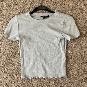 Grey stretchy short sleeve shirt in a size small.